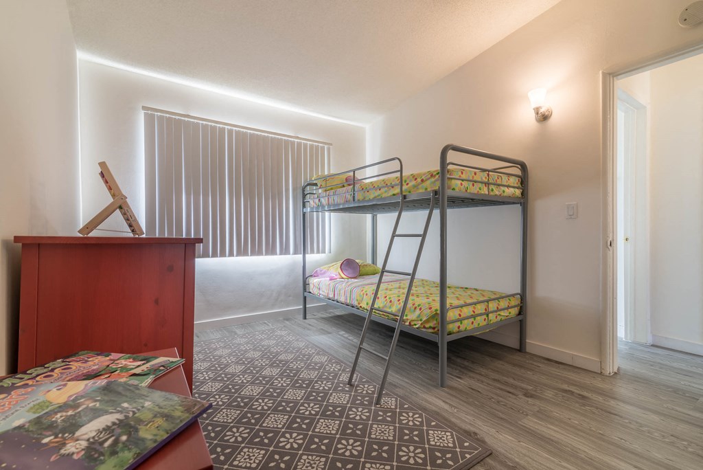 bedroom view with window covering at Serrano Apartments, West Covina, California