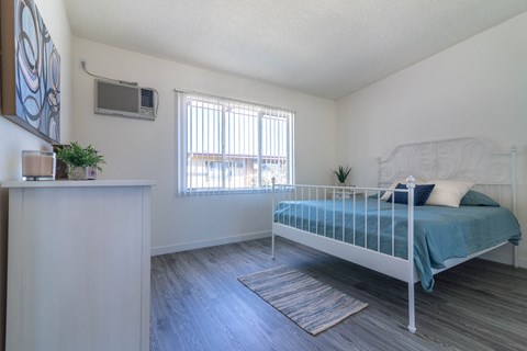 bedroom with to outside at Serrano Apartments, West Covina