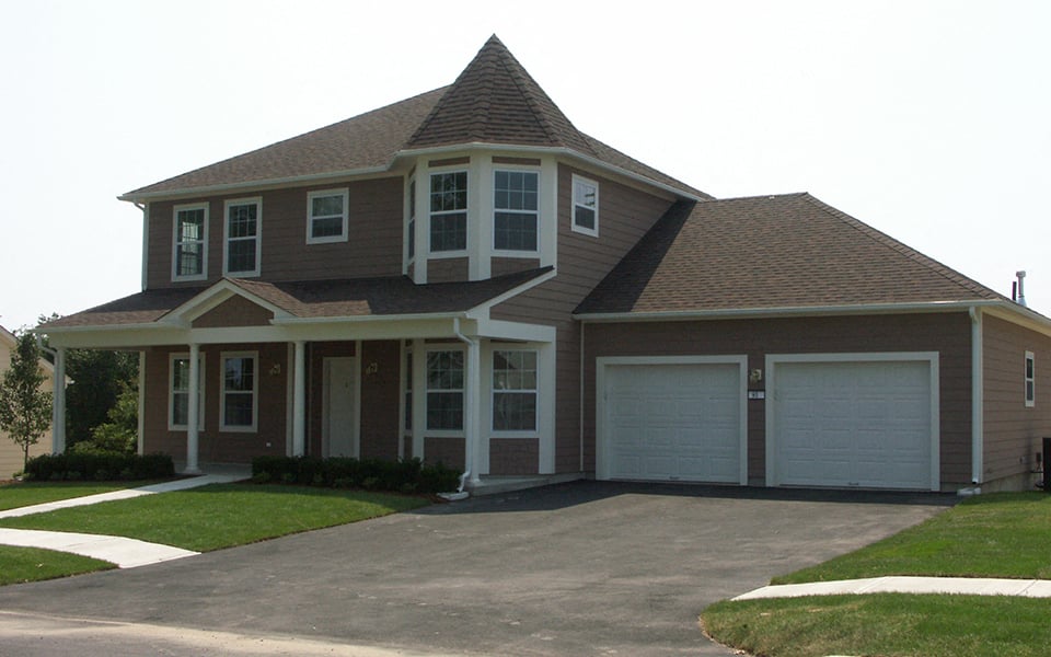 a house with a drive way in front of it
