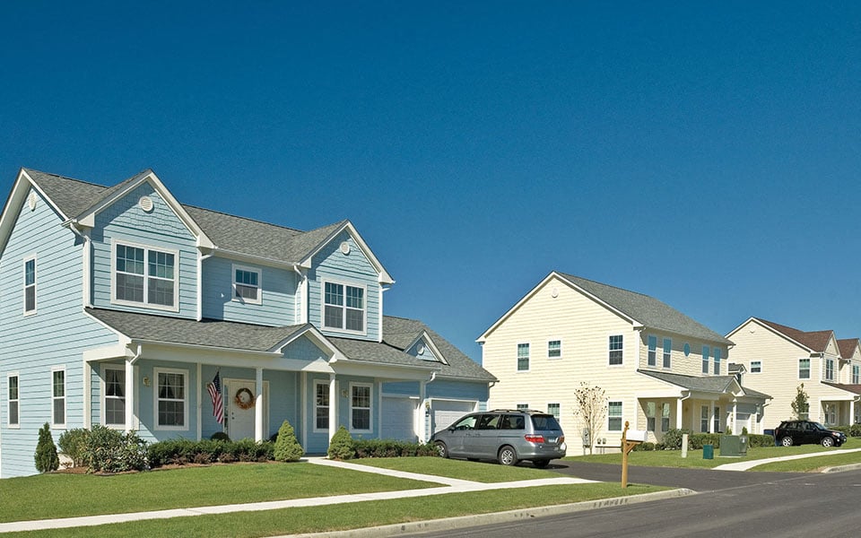 a row of houses on the side of a street
