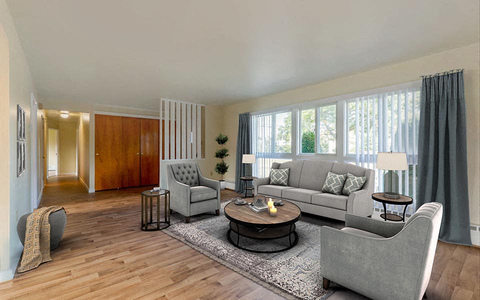 a living room with couches and chairs and a table
