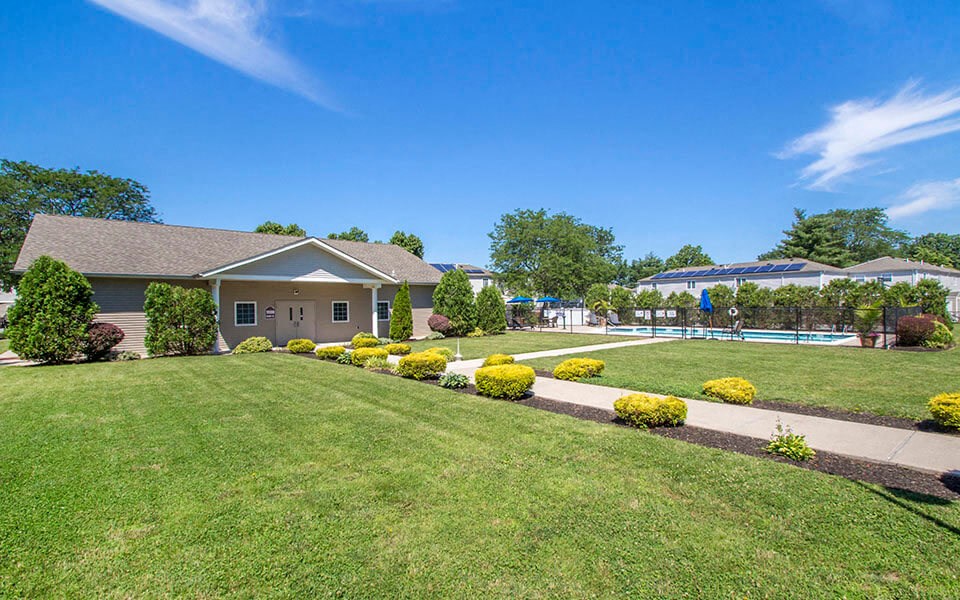 a house with a yard and a swimming pool