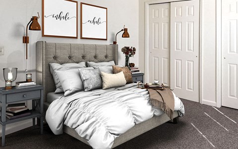 a bedroom with a bed and pillows in it