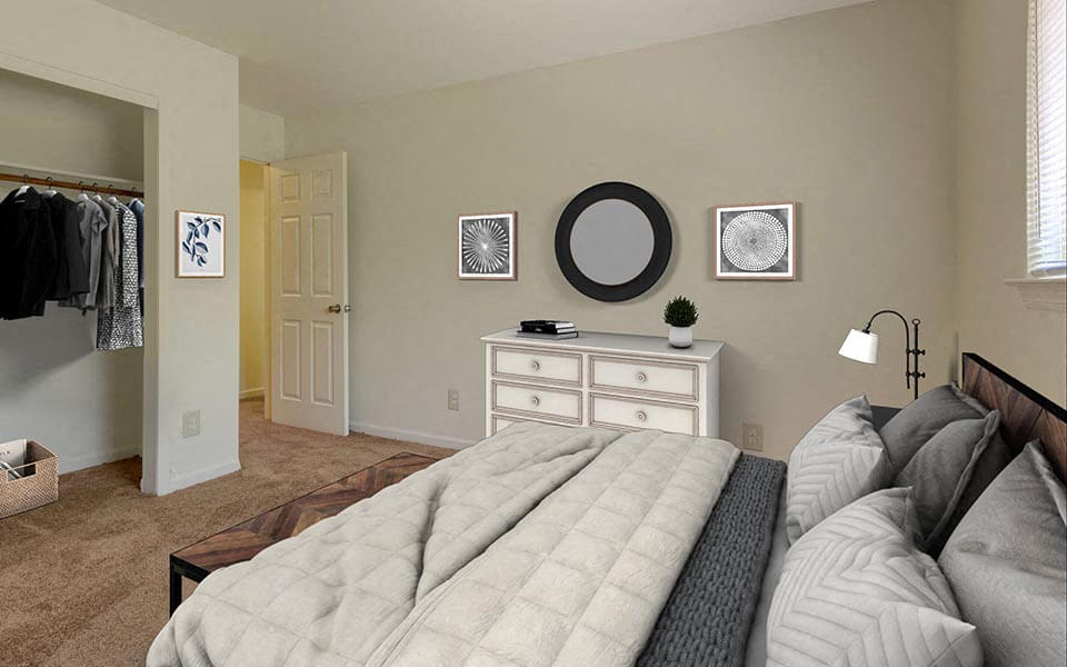 a bedroom with a bed and a dresser