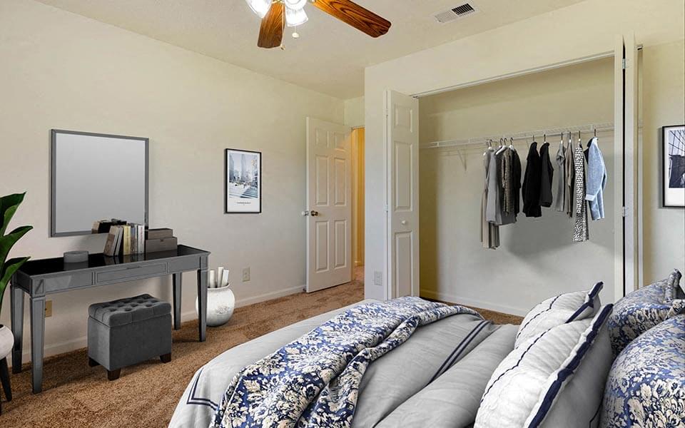 a bedroom with a bed and a closet