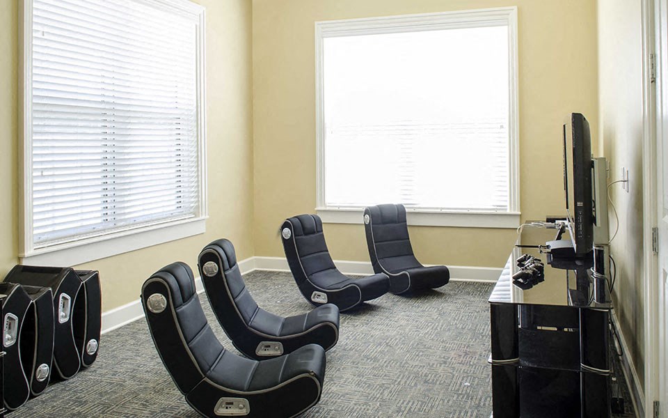 a conference room with chairs and a tv