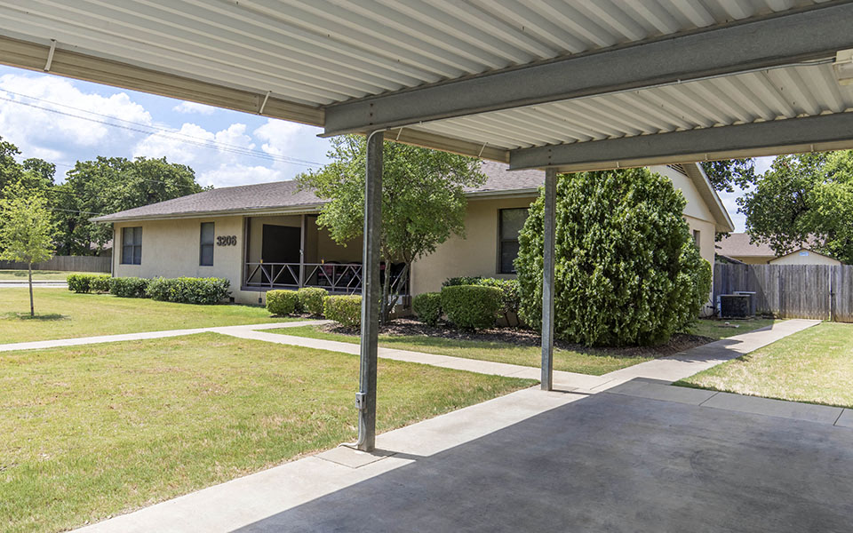 a house with a porch and a driveway