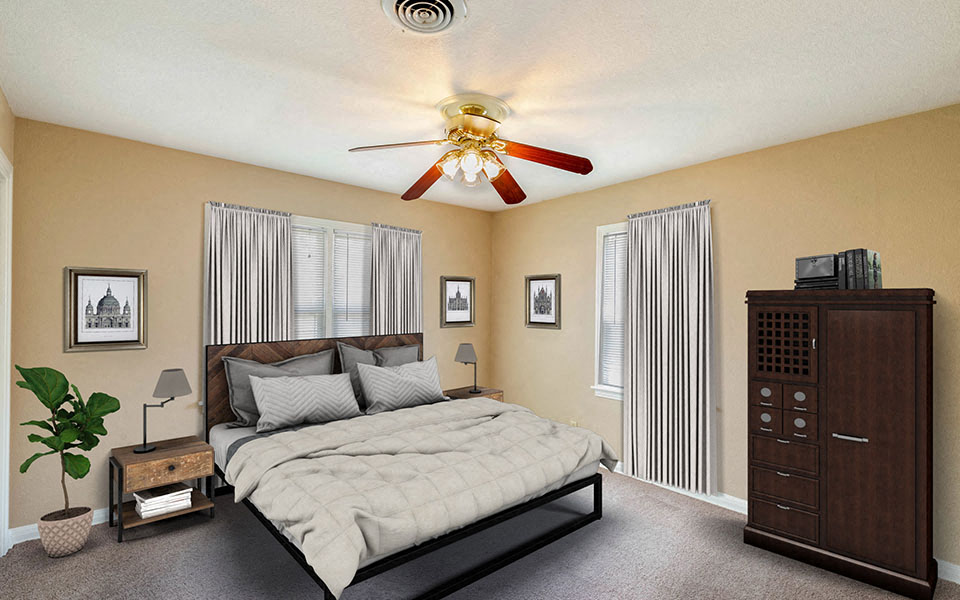 a bedroom with a ceiling fan and a bed