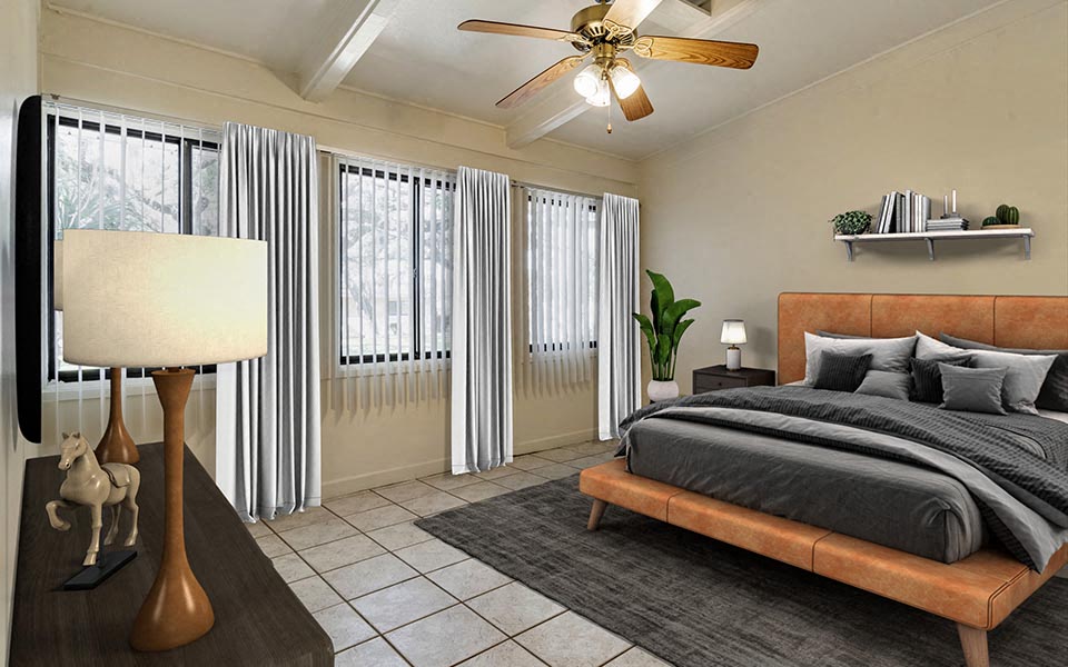 a bedroom with a bed and a ceiling fan