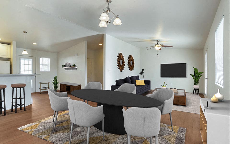 a living room and dining room with a table and chairs