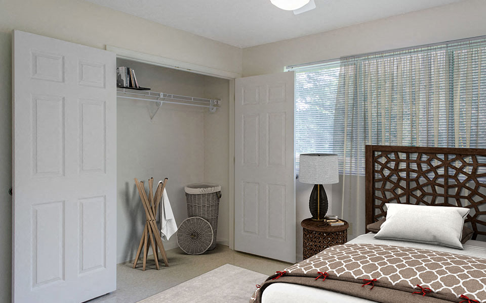 a bedroom with a bed and a closet