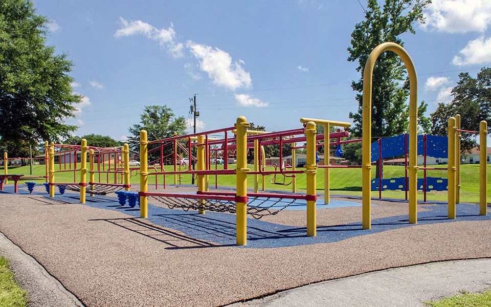 a playground with colorful equipment on a sunny day