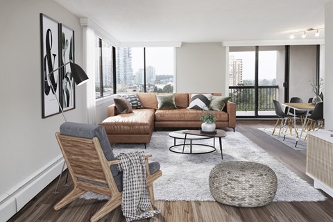 a living room with a couch and a chair and a table