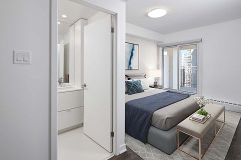 a bedroom with a large bed and a window