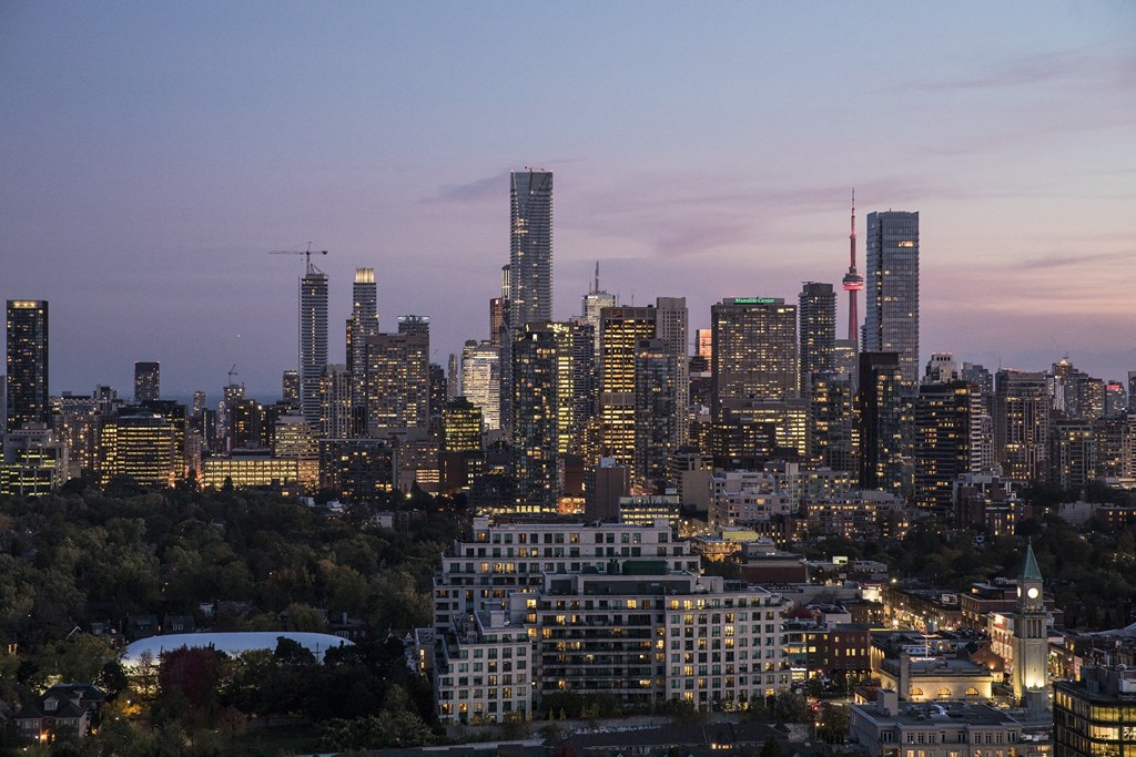 the skyline of the city at dusk