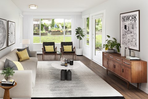 a living room with a white couch and a coffee table