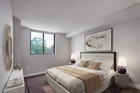bedroom with white walls and a large bed with white sheets and pillows