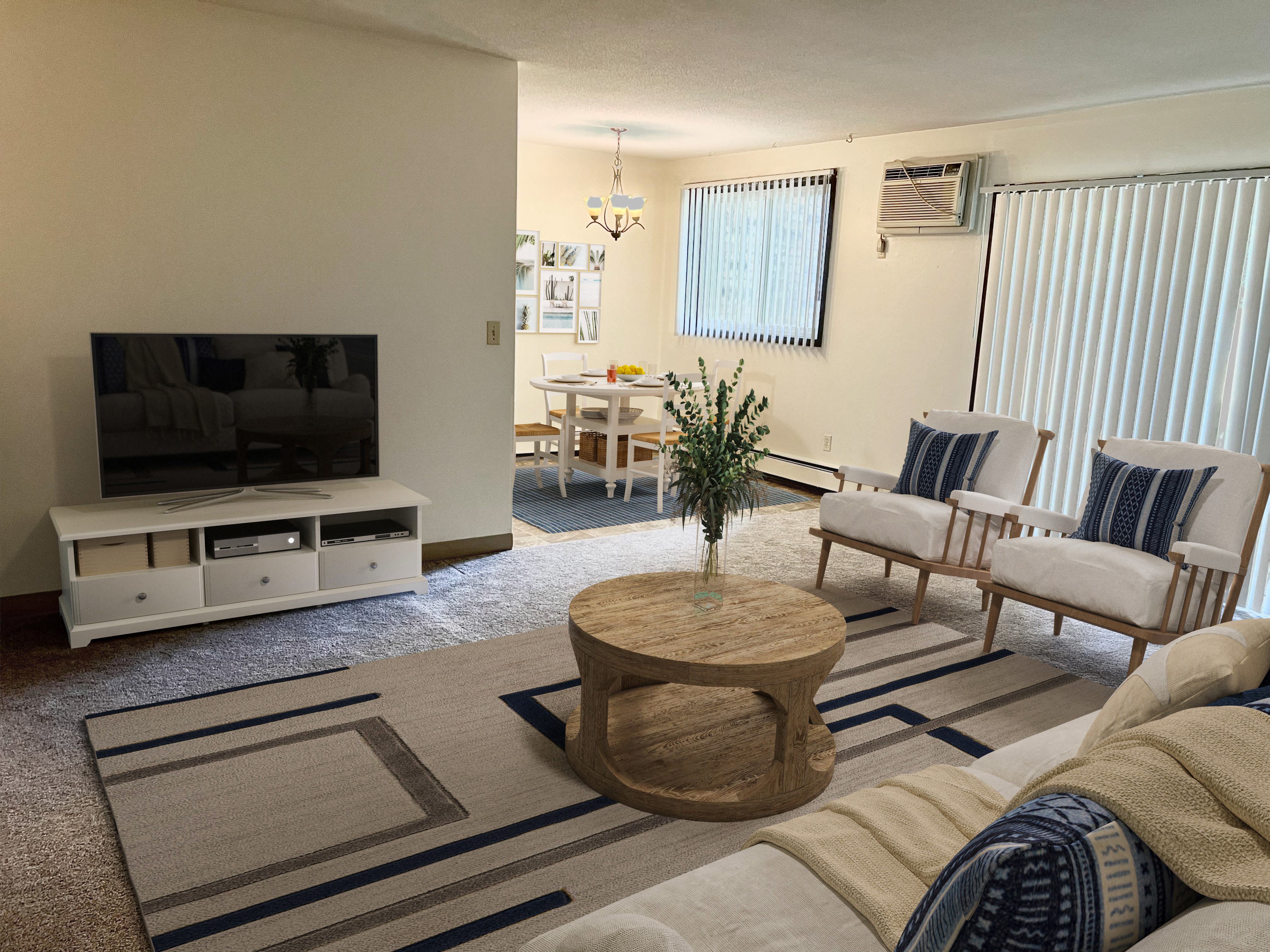 a living room with a couch and a table and a television