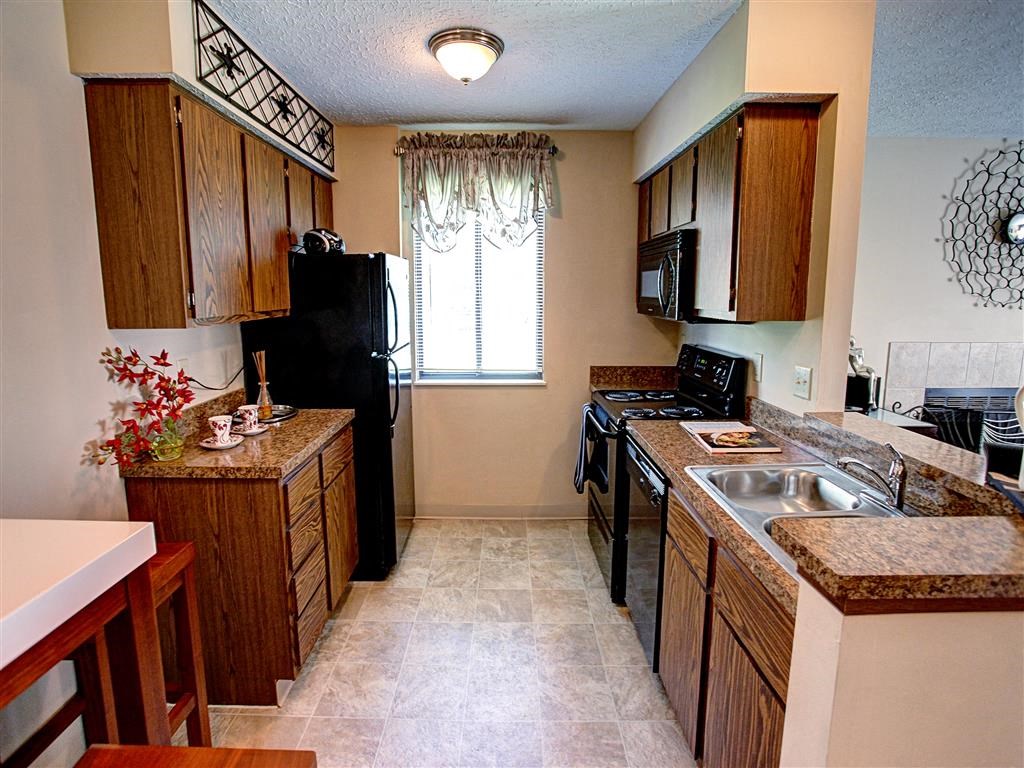 a kitchen with a stove and a sink