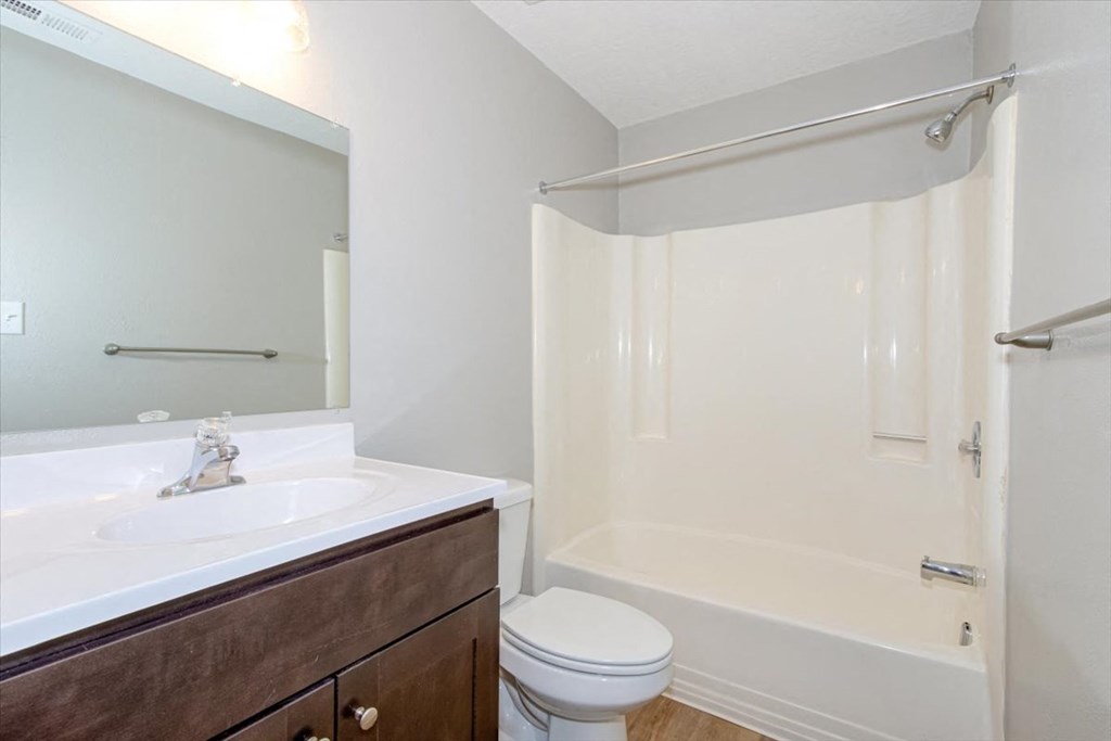 a bathroom with a sink toilet and a shower