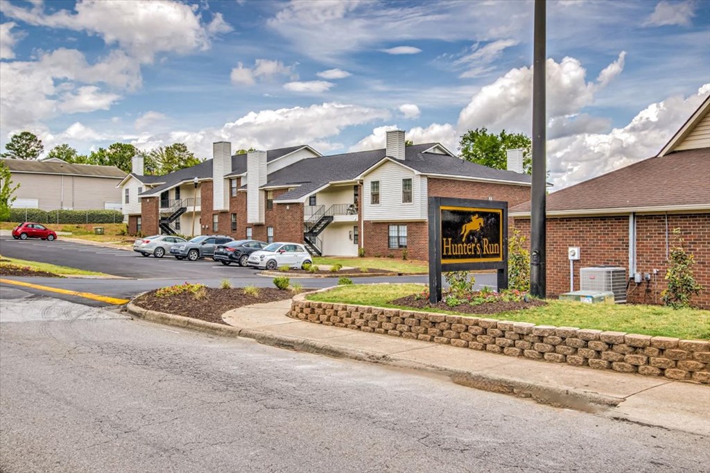 a street with a sign in front of some houses