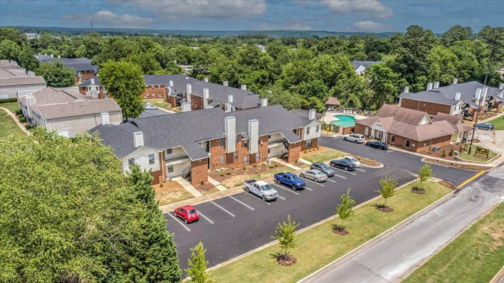 an aerial view of a neighborhood with houses and cars parked on the street