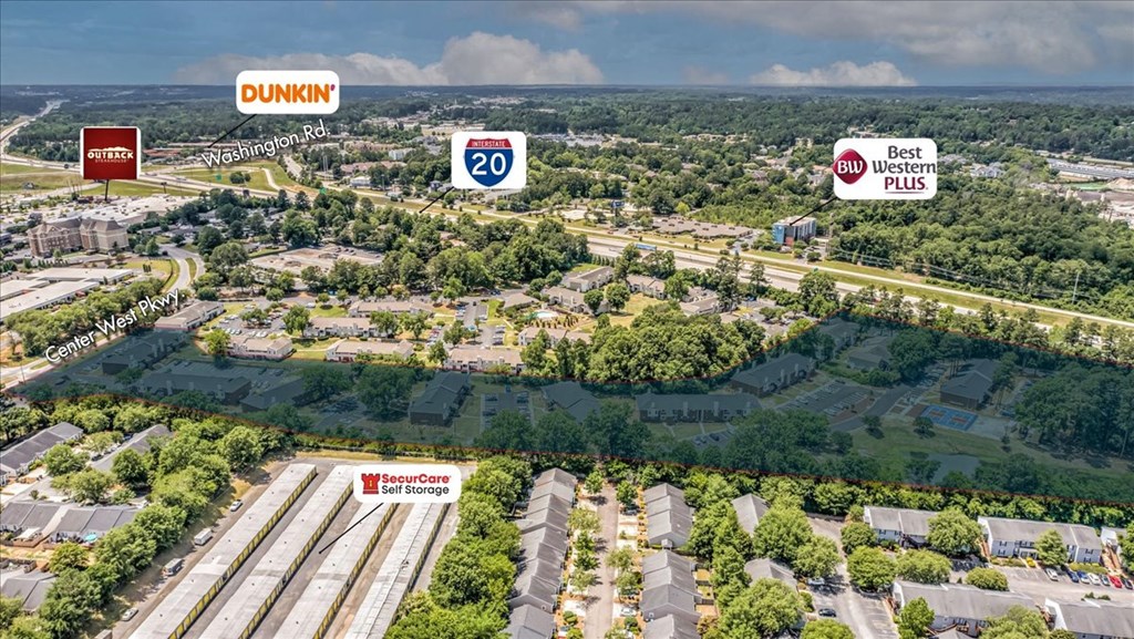 an aerial view of a neighborhood with highways and trees and buildings