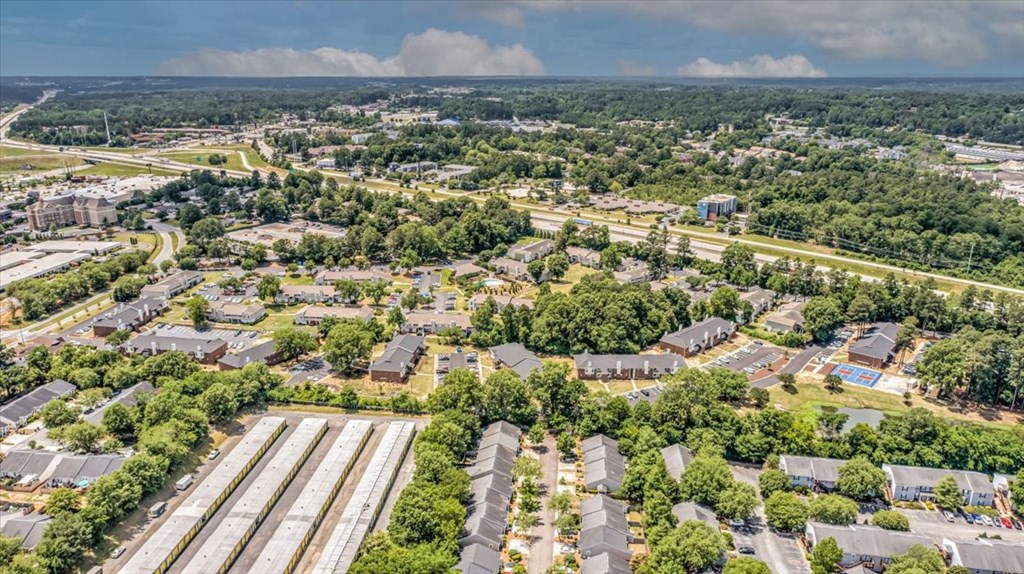 an aerial view of a neighborhood with houses and trees