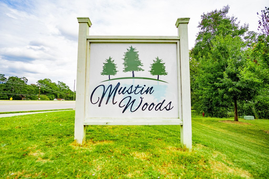 the sign for muffin m m woods on the grass