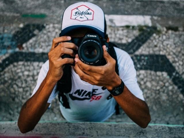 a man taking a picture of himself with a camera