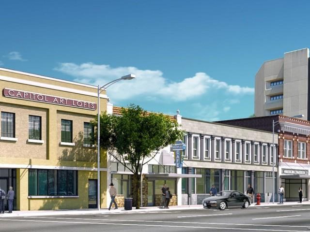 a city street with a car parked in front of a building