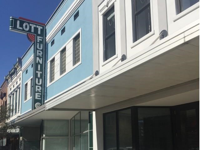 a blue and white building with a loft sign