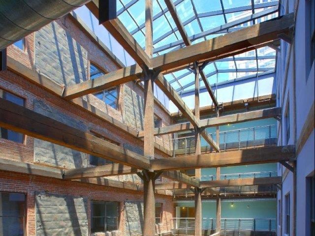 a large building with lots of windows and a glass ceiling