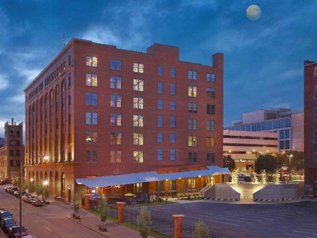 a large building in the middle of a city at night