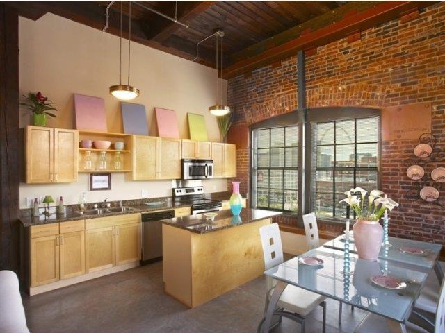 a kitchen and dining room with a table and chairs