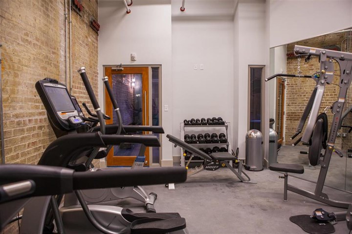 a gym with a lot of exercise equipment in it