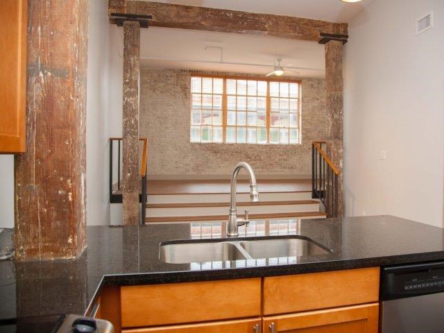 a kitchen with a sink and a window
