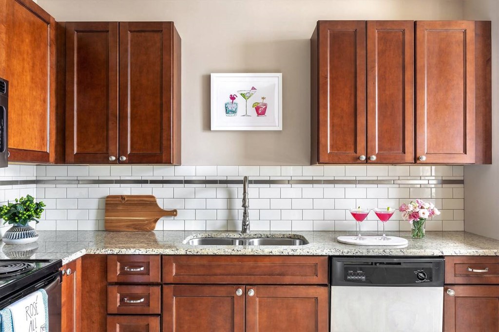 a kitchen with wooden cabinets and a sink