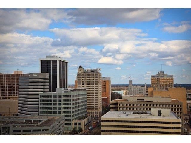 a view of a city with a cloudy sky