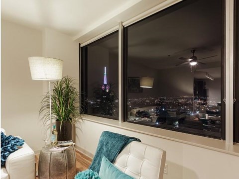 a living room with a couch and a window