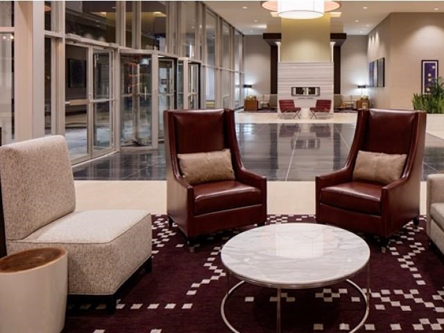 a lobby with chairs and a coffee table