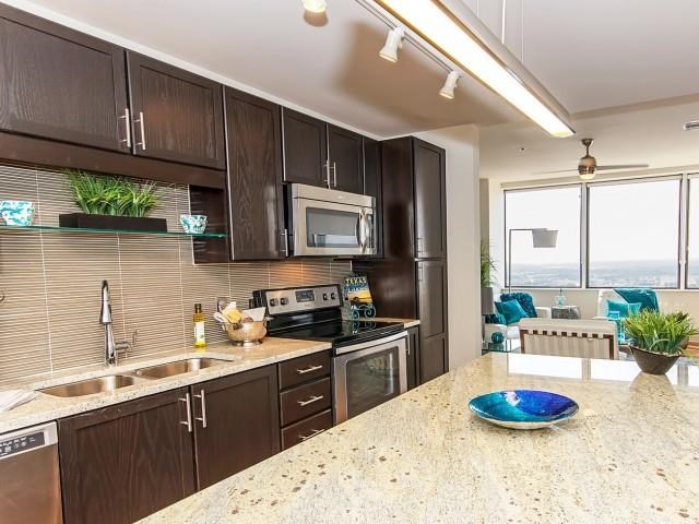 a kitchen with a counter top and a sink