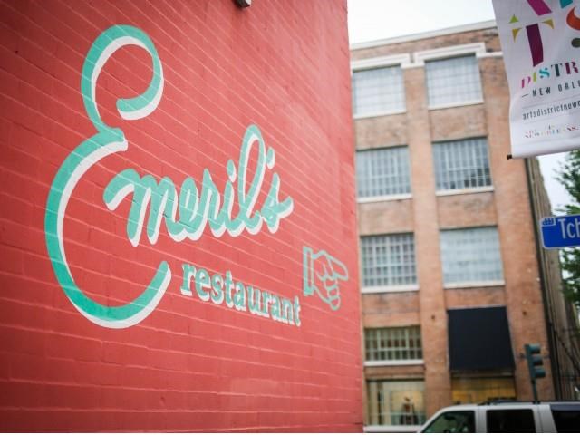 a red building with a sign on the side of it