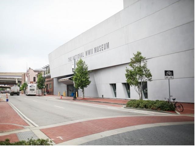 a white building on the side of a street