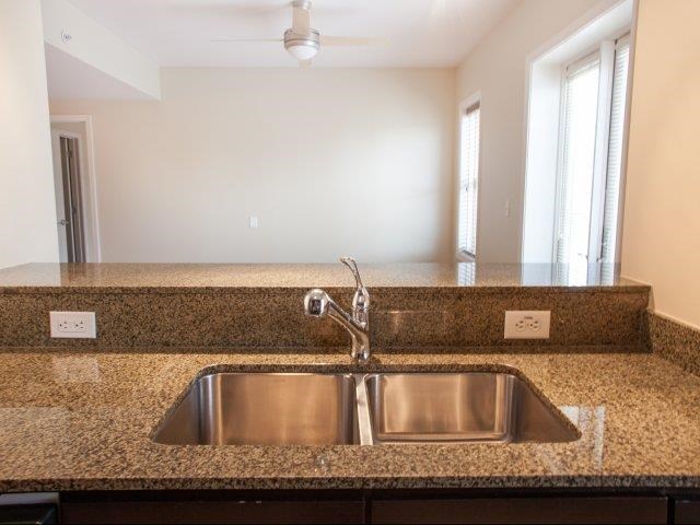 a kitchen with a sink and a counter top
