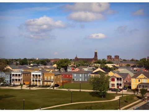 a view of a neighborhood with houses and a field