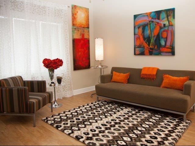 a living room with a couch and a chair
