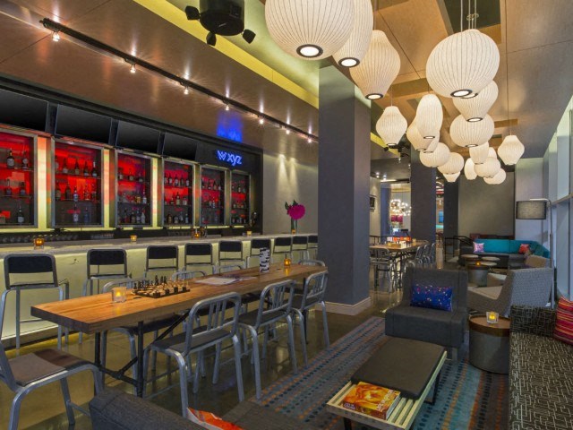 a restaurant with a bar and tables and chairs