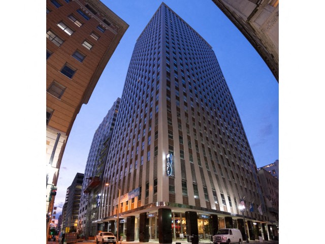 a tall building with a street in front of it