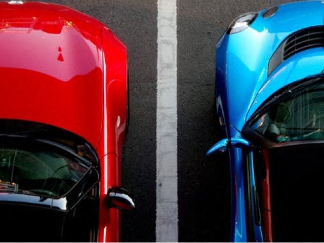 two red and blue cars parked next to each other